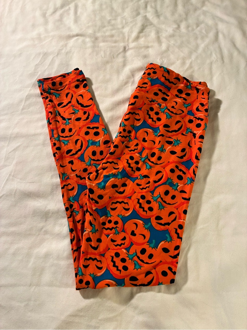 LuLaRoe Bright Orange Pumpkin Face Leggings with Teal Accents